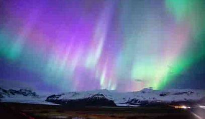 Aurora Borealis or Northern Light over mountains
