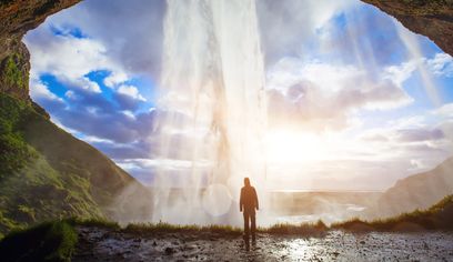 Seljalandsfoss Waterfall with Man behind Waterfall